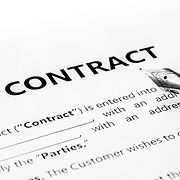 Close-up of a silver pen on docunent contract_edited
