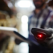 Closeup of bar code reader in hand of un
